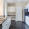 a kitchen with white cabinets