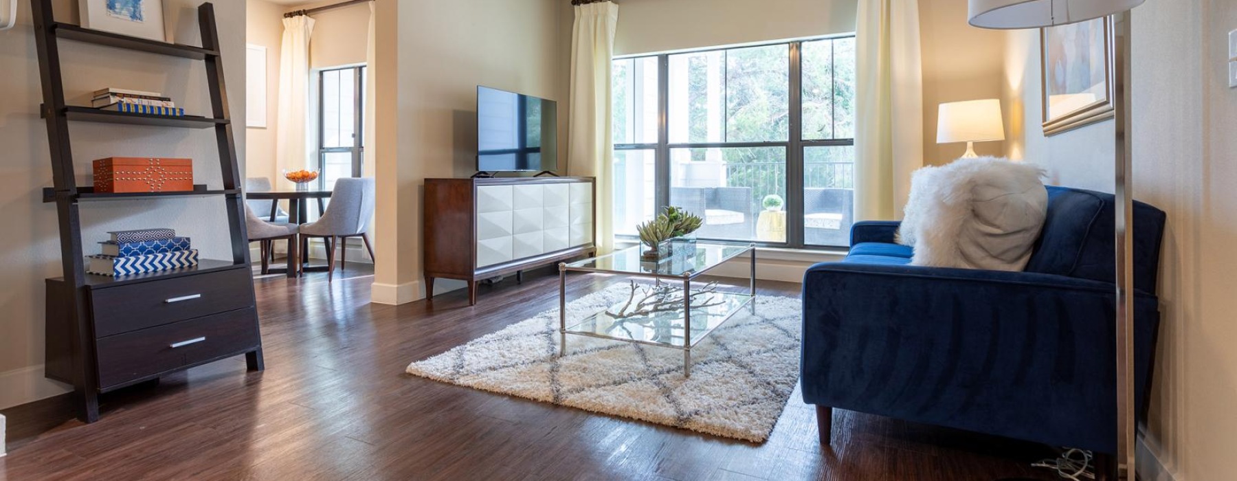 a living room with a blue couch