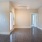 a room with a wood floor and white walls